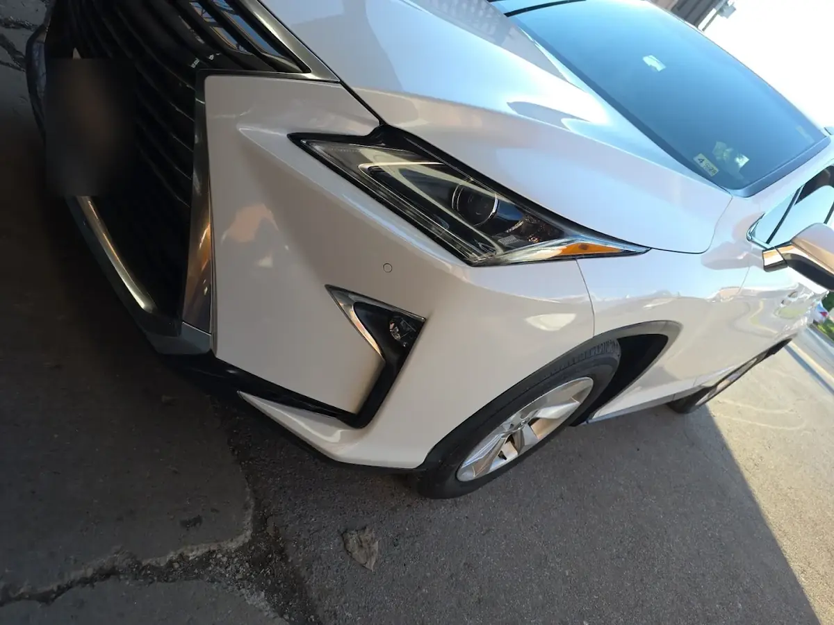 Flawless white paint finish on a Lexus at Kenny Auto Body